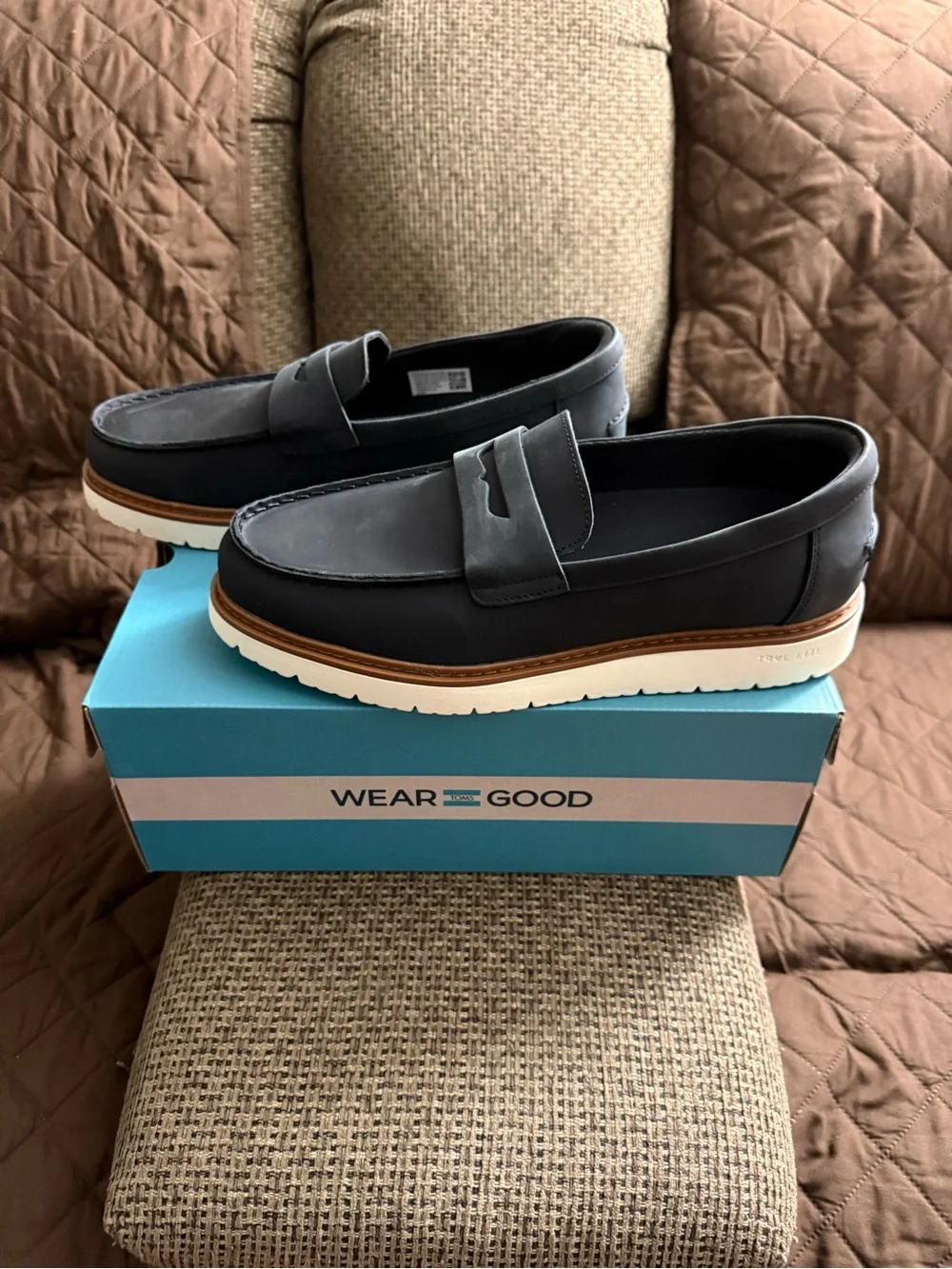TOMS Black Leather Penny Loafers with Tan Welt and White Sole